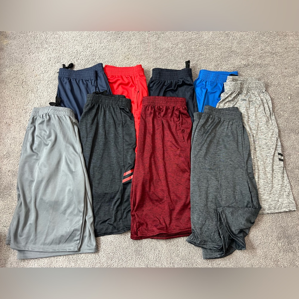 9 pairs of boys xtra large basket ball shorts.